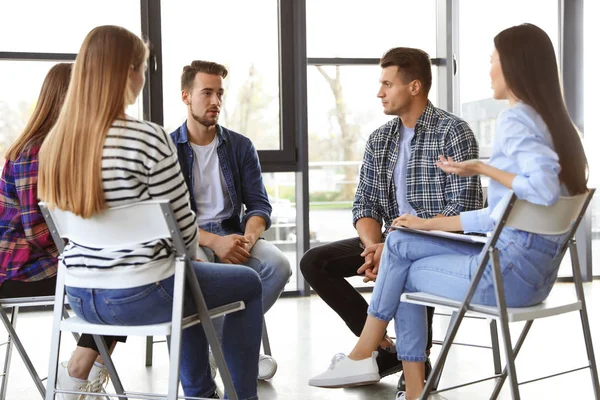 man talking with friends about whether php vs iop is right for him